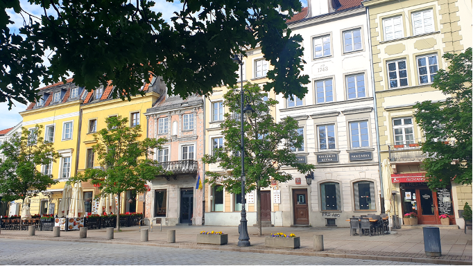 Krakowskie Przedmieście, Warsaw, Poland - A historic street adorned with charming tenement houses, each exuding its own unique character and architectural charm. This iconic thoroughfare showcases Warsaw's cultural tapestry through its well-preserved buildings, reflecting the city's rich heritage.